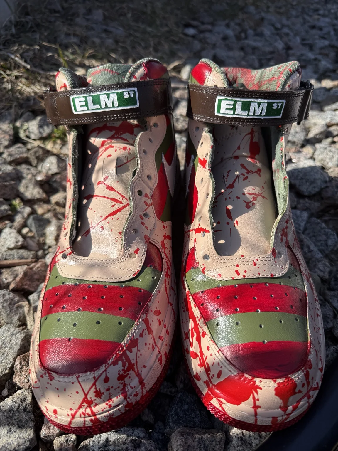 Finished custom sneaker pair photographed outdoors