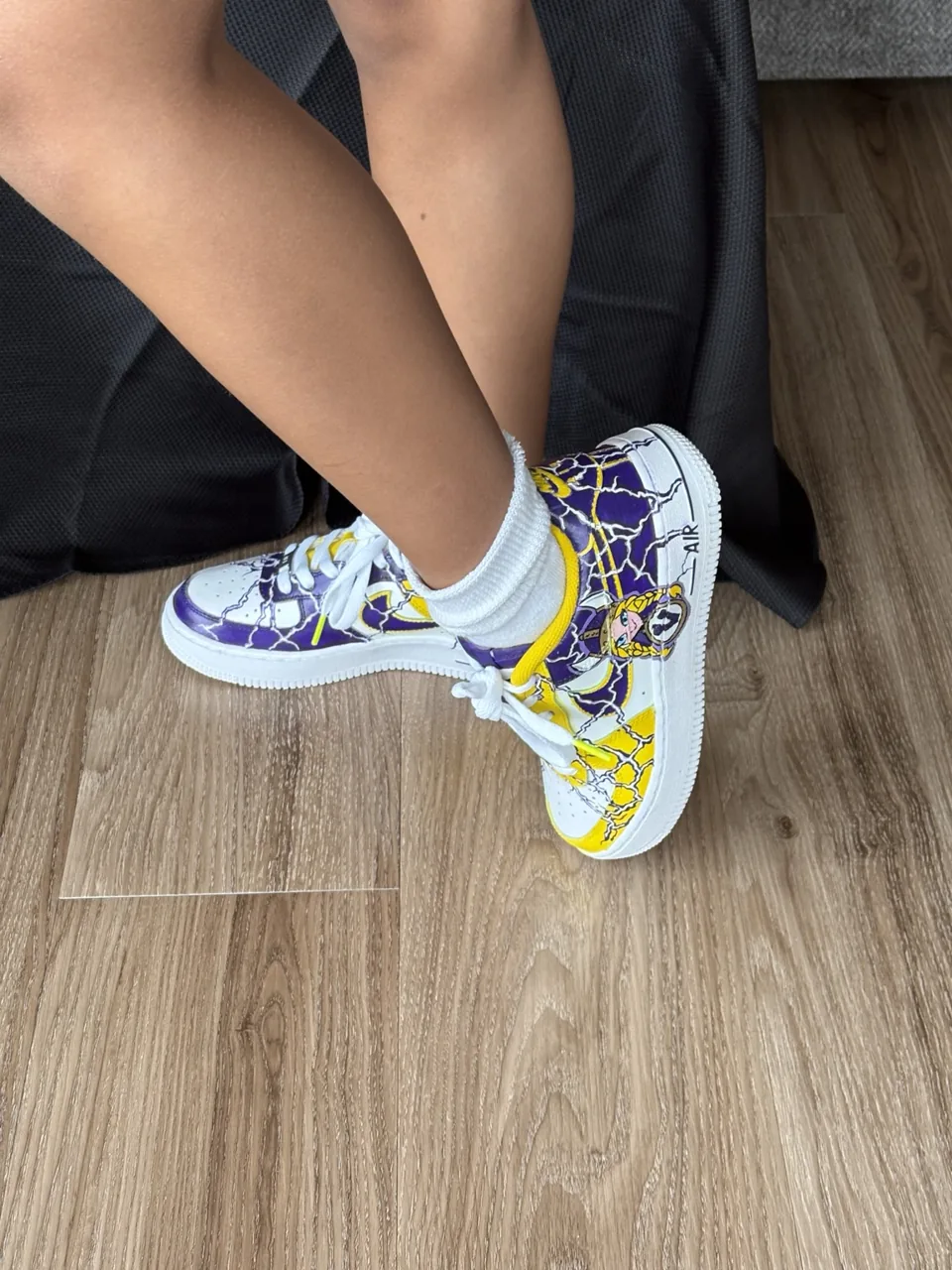 Crossed-foot side view of the finished Vikings custom pair